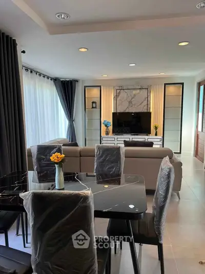 Modern living room with elegant dining area and stylish decor