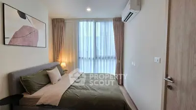 Modern bedroom with stylish decor and natural light in a contemporary apartment.