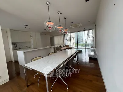 Spacious modern dining area with marble table and city view