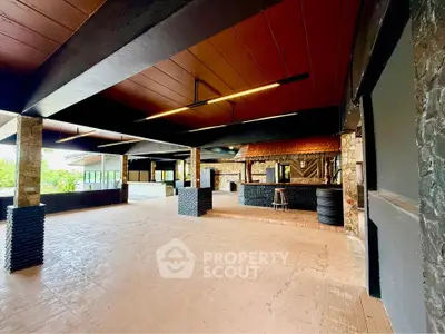 Spacious open-air terrace with modern design and scenic views, perfect for gatherings and relaxation.