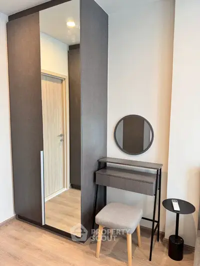 Modern bedroom corner with stylish wardrobe and vanity set