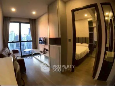 Modern apartment with city view, featuring cozy living room and elegant bedroom.