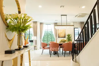 Elegant living room with modern decor and large windows