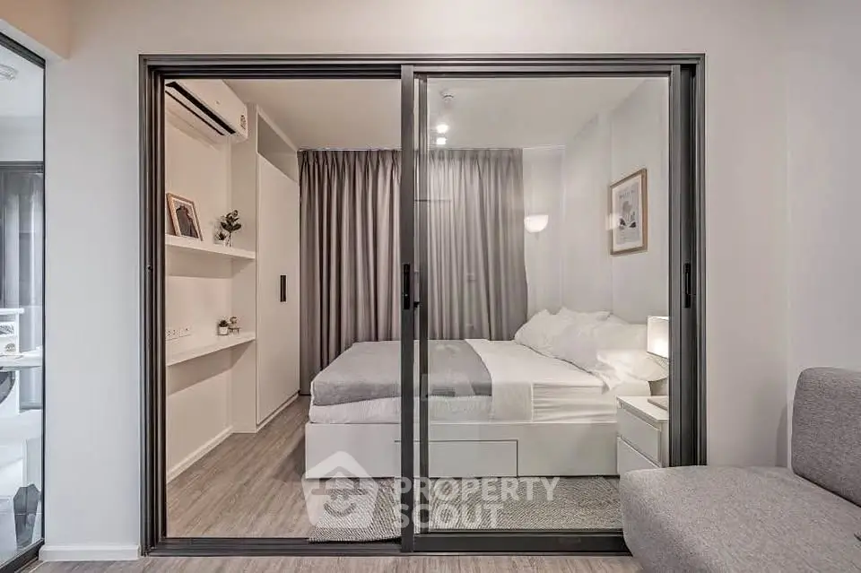 Modern bedroom with sliding glass doors and elegant decor