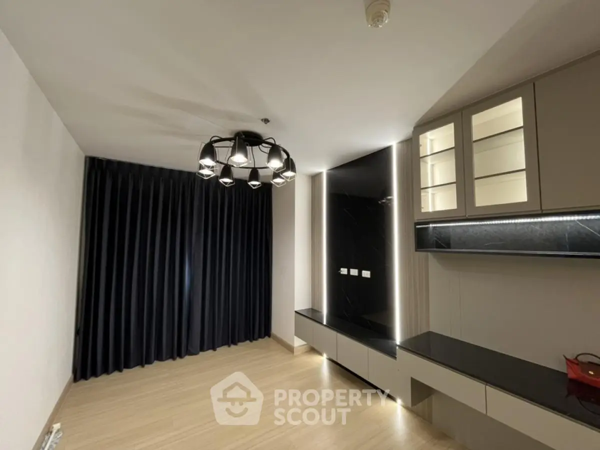 Modern living room with stylish lighting and sleek cabinetry