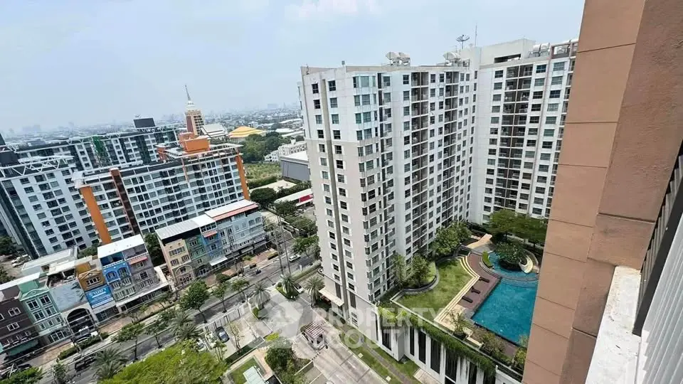 Stunning high-rise apartment with pool and city view, perfect for urban living.