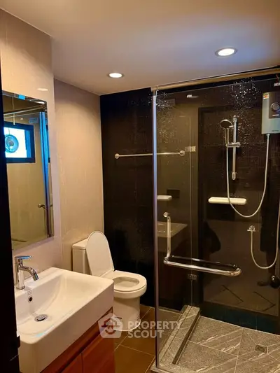 Modern bathroom with glass shower and sleek fixtures