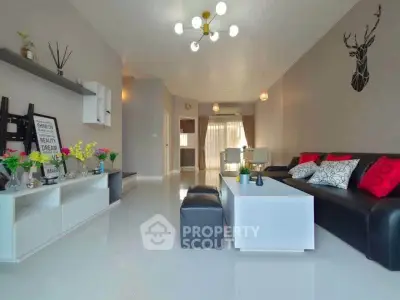 Spacious modern living room with sleek decor and ample natural light