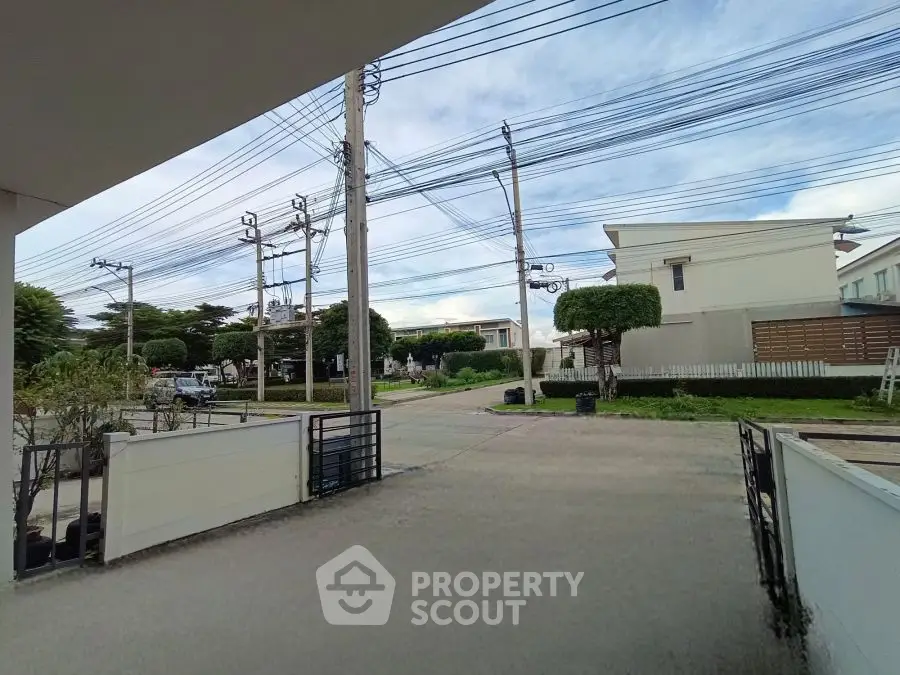 Modern residential neighborhood with clear sky and well-maintained surroundings.