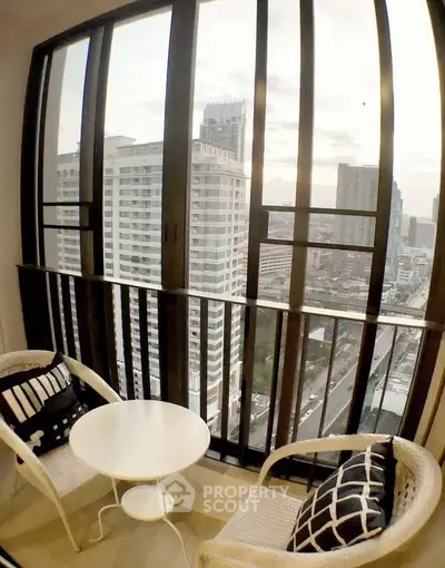 Chic urban balcony with stunning cityscape view, perfect for relaxation and enjoying the skyline.