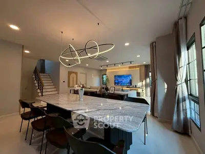 Luxurious open-plan living room with modern lighting and elegant decor