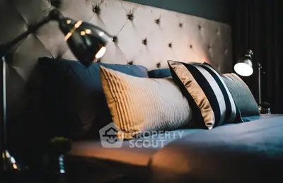 Luxurious bedroom with elegant lighting and plush pillows for ultimate comfort.