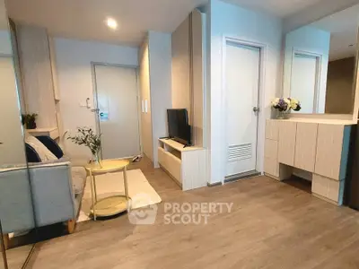 Modern living room with sleek furniture and stylish decor in a cozy apartment.