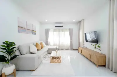 Spacious modern living room with elegant decor and natural light