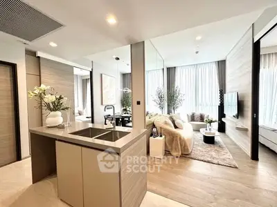 Luxurious open-plan living room and kitchen with modern decor and natural light