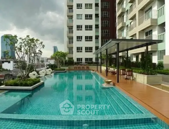 Luxurious condominium with stunning rooftop pool and city views, perfect for urban living.