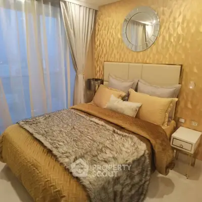 Luxurious bedroom with elegant gold accents and plush bedding
