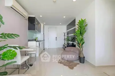 Modern open-plan living room with sleek kitchen and stylish decor