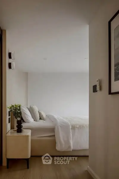 Cozy modern bedroom with elegant decor and soft lighting, perfect for relaxation.