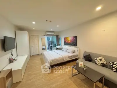 Spacious modern bedroom with cozy decor and natural light