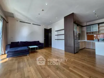 Spacious modern living room with open kitchen and hardwood floors