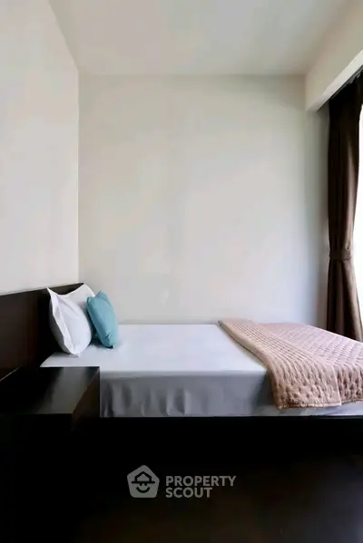 Modern minimalist bedroom with sleek design and natural light