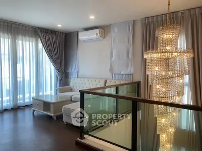 Luxurious living room with elegant chandelier and modern decor