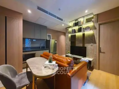 Modern living room with stylish furniture and open kitchen layout