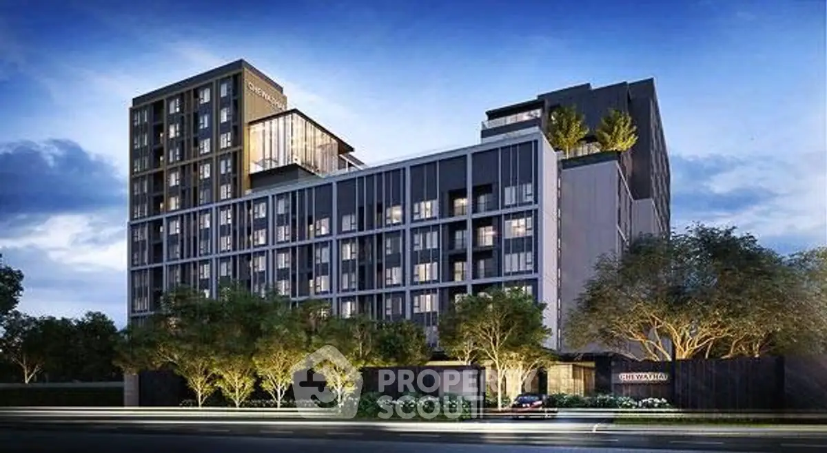 Modern apartment building exterior with lush greenery and stylish architecture.