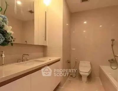 Elegant bathroom with modern fixtures and bathtub in a luxurious real estate property.