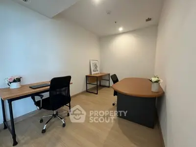 Modern study room with two desks and chairs, ideal for productivity and focus.