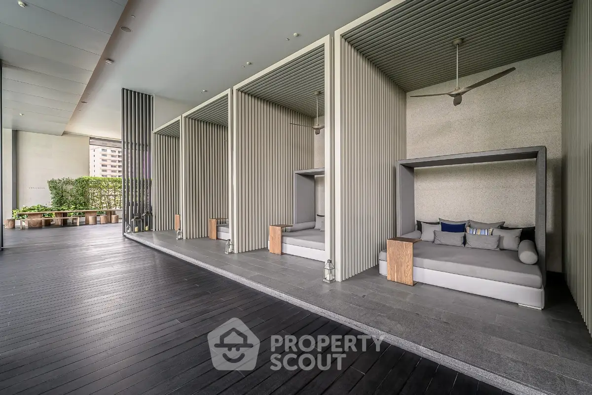 Luxurious outdoor lounging area with modern cabanas and sleek design.