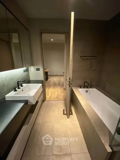 Modern bathroom with sleek design and bathtub in contemporary apartment