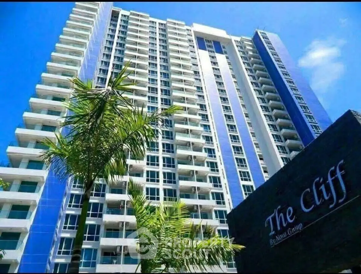 Stunning high-rise building with modern architecture and lush greenery, perfect for urban living.
