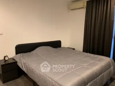 Cozy bedroom with modern decor and air conditioning, perfect for restful nights.