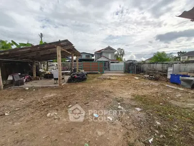 Spacious vacant lot with potential for development in a residential area.