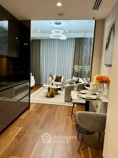 Luxurious open-plan living room with elegant decor and modern lighting