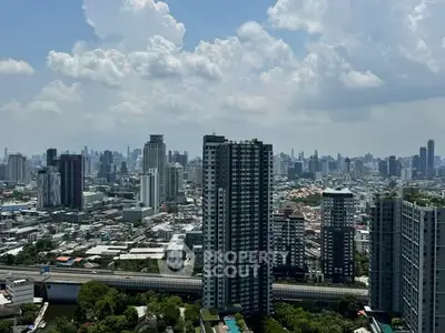 Stunning cityscape view from high-rise building showcasing urban skyline and modern architecture.