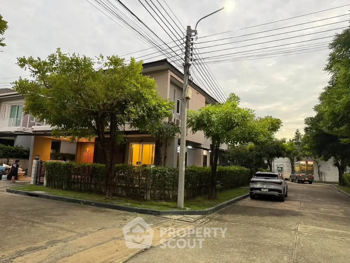 Charming suburban home with lush greenery and street view, perfect for family living.