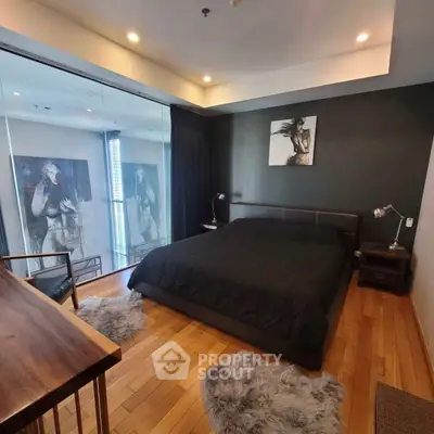 Luxurious bedroom with modern decor and wooden flooring in high-end apartment