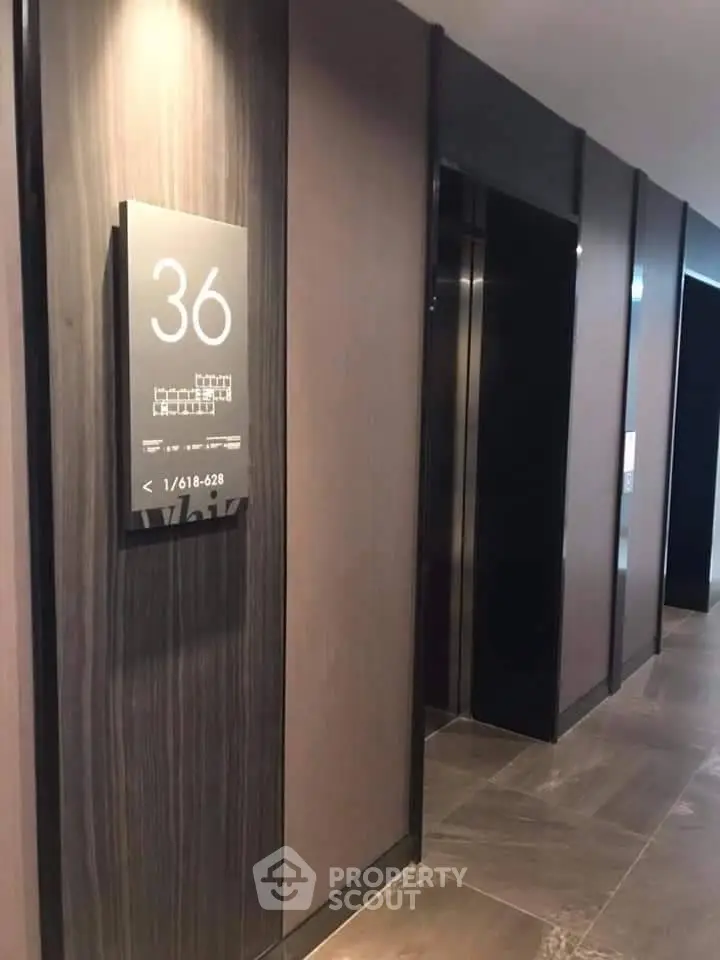 Modern elevator lobby on the 36th floor with sleek design and elegant finishes.