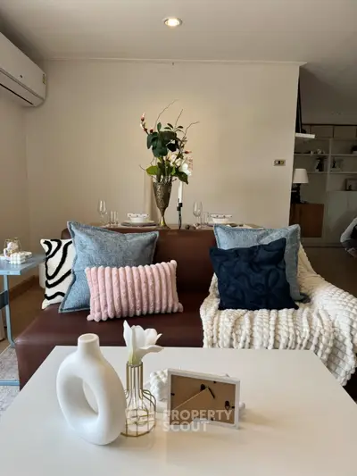 Stylish living room with cozy decor and modern furniture, perfect for relaxation and entertaining.