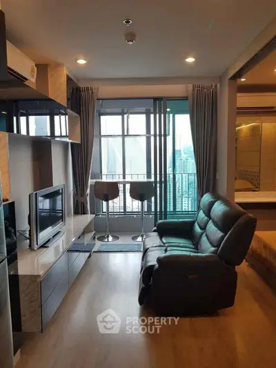 Modern living room with city view and stylish furniture in high-rise apartment
