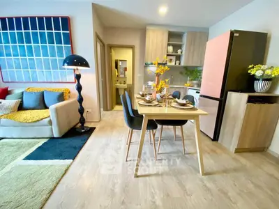 Modern open-plan living and dining area with stylish decor and natural light.