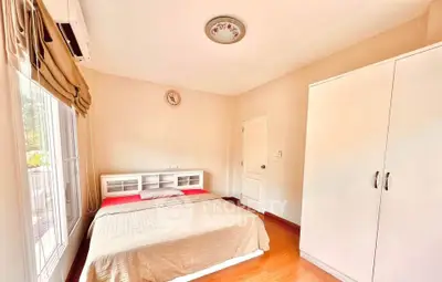 Bright and cozy bedroom with natural light and modern furnishings