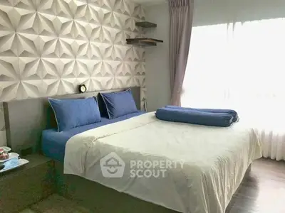 Modern bedroom with stylish 3D wall design and cozy bedding