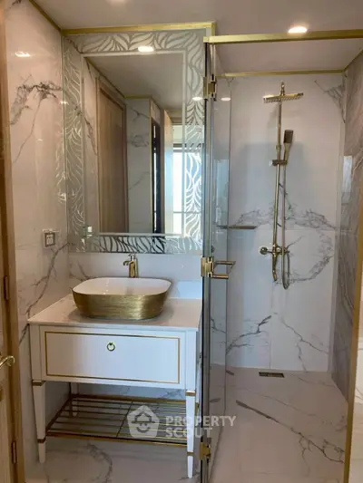 Luxurious modern bathroom with elegant marble design and gold accents