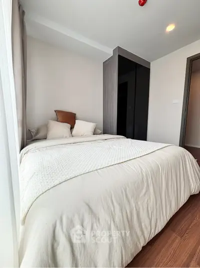 Cozy bedroom with modern design and ample natural light