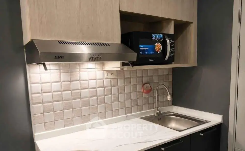 Modern kitchen with sleek cabinetry and built-in appliances
