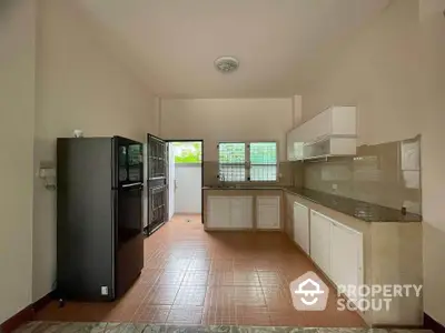 Spacious kitchen with modern appliances and ample natural light